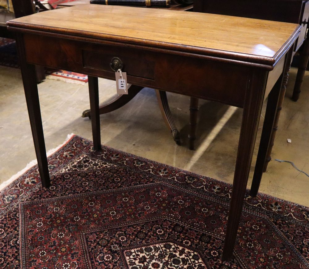 A George III rectangular mahogany folding tea table, width 91cm, depth 44cm, height 72cm